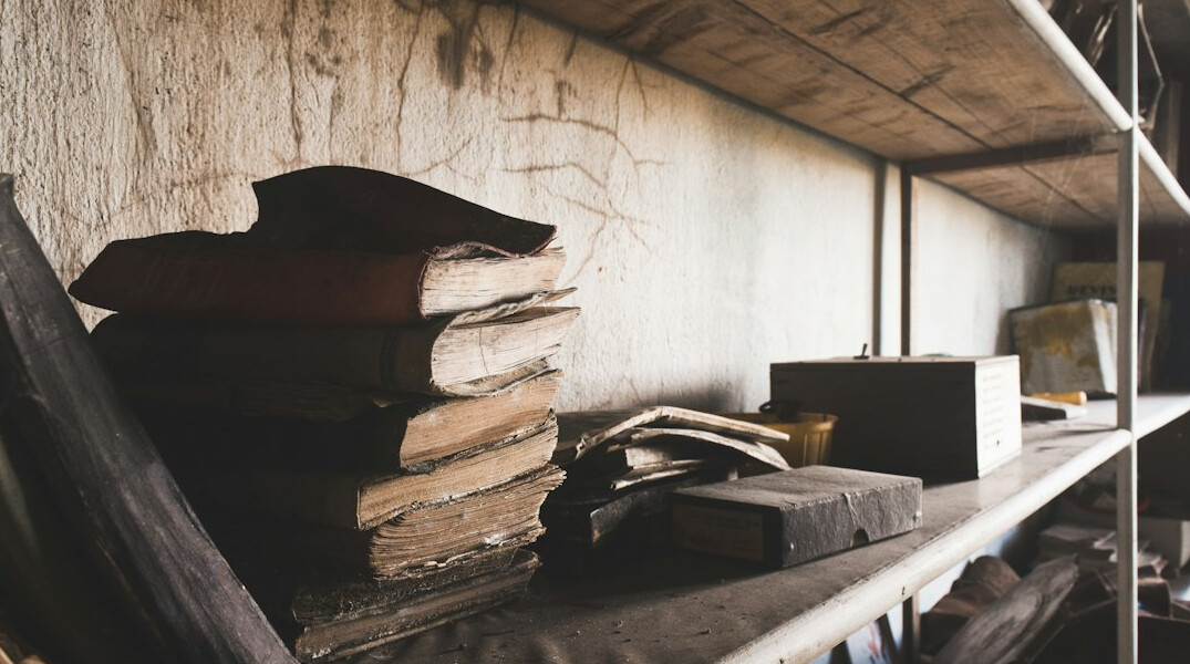 Desk covered in documents and files used for an investigative report